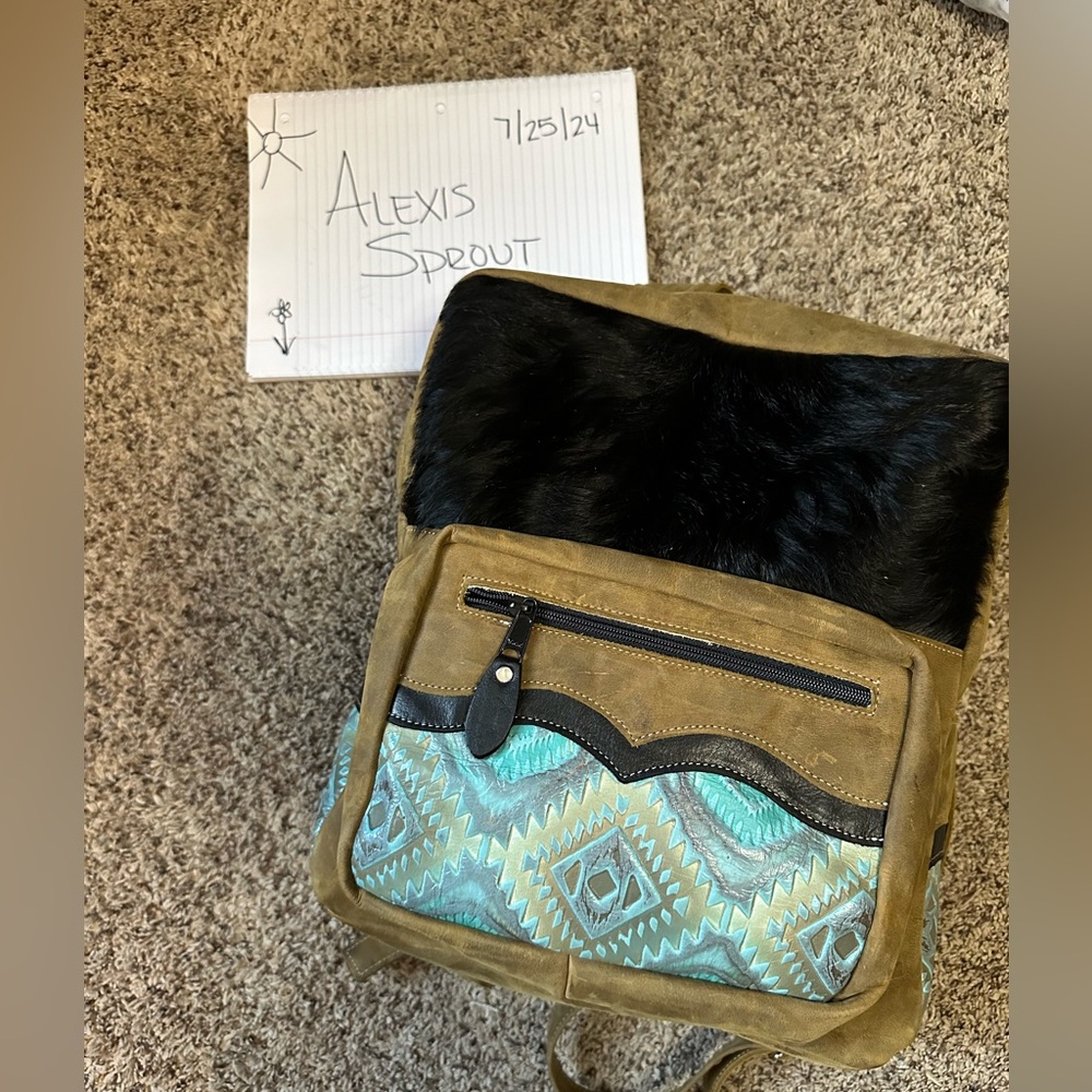 Crimson Willow backpack with hair on hide and leather